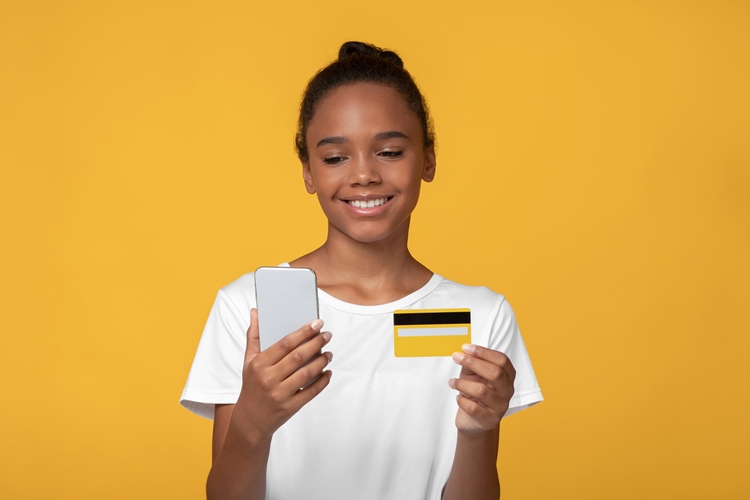 Young care leaver with bank card and banking app